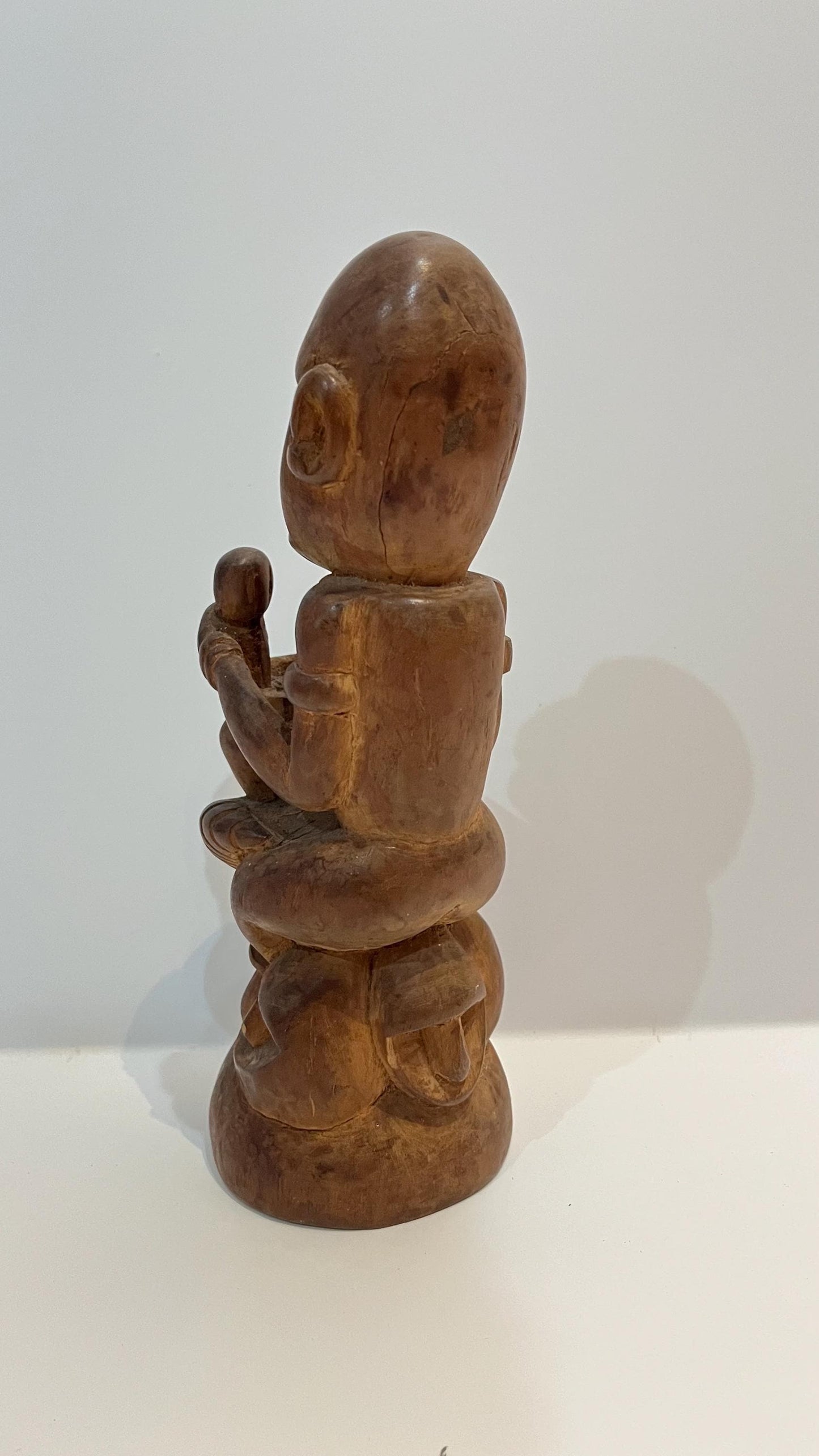 Hand-Carved Sandalwood Tribal Statue: Balinese Wood Art